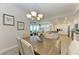 Open concept dining area with view into kitchen and living room at 396 Aruba Cir # 103, Bradenton, FL 34209