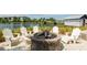 Relax by the fire pit with lake views and comfortable seating at 396 Aruba Cir # 103, Bradenton, FL 34209