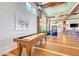 Community clubhouse featuring a shuffleboard table and comfortable seating at 396 Aruba Cir # 103, Bradenton, FL 34209
