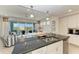 Open concept kitchen with island overlooking living room and patio at 396 Aruba Cir # 103, Bradenton, FL 34209