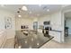 Bright kitchen featuring white cabinets and a large island at 396 Aruba Cir # 103, Bradenton, FL 34209