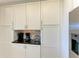 White shaker cabinets and ample storage in this kitchen at 396 Aruba Cir # 103, Bradenton, FL 34209