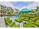 Enjoy the green lounge furniture near the pool at 396 Aruba Cir # 103, Bradenton, FL 34209