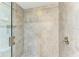 Spacious shower with glass enclosure and beige tile at 396 Aruba Cir # 103, Bradenton, FL 34209
