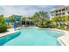 Relaxing kidney-shaped pool with surrounding patio at 396 Aruba Cir # 103, Bradenton, FL 34209