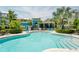 Community pool with plenty of lounge chairs at 396 Aruba Cir # 103, Bradenton, FL 34209