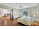 Main bedroom with hardwood floors and access to private balcony at 421 Island Cir, Sarasota, FL 34242