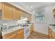 Bright kitchen featuring granite countertops and ample cabinetry at 421 Island Cir, Sarasota, FL 34242