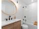 Clean bathroom with a modern vanity, a bathtub, and a frameless glass shower at 4427 Amanda Way, Sarasota, FL 34232