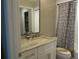 Updated bathroom with granite vanity and zebra-print shower curtain at 4470 Weybridge # 68, Sarasota, FL 34235