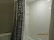 Clean bathroom with shower/tub combo and zebra print shower curtain at 4470 Weybridge # 68, Sarasota, FL 34235