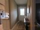 Clean entryway with console table and access to other rooms at 4470 Weybridge # 68, Sarasota, FL 34235