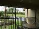 This lanai offers scenic views of a pond and golf course at 4470 Weybridge # 68, Sarasota, FL 34235