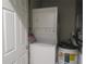 Stackable washer and dryer in convenient laundry closet at 4470 Weybridge # 68, Sarasota, FL 34235