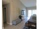 Spacious living room with hardwood floors and large windows at 4470 Weybridge # 68, Sarasota, FL 34235
