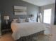 Large main bedroom with king-size bed and neutral decor at 4470 Weybridge # 68, Sarasota, FL 34235