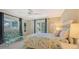 Guest bedroom with a comfortable bed and access to a private patio at 5165 Sandy Cove Ave, Sarasota, FL 34242