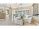 Cozy sitting area near kitchen with white slipcovered chairs at 5165 Sandy Cove Ave, Siesta Key, FL 34242