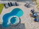 Relaxing kidney-shaped pool and spa with patio furniture at 5218 6Th Avenue W Dr, Bradenton, FL 34209