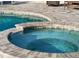 Relax in this inviting spa adjacent to the pool at 5218 6Th Avenue W Dr, Bradenton, FL 34209