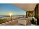 Serene balcony with ocean views and comfortable seating at 535 Sanctuary Dr # C408, Longboat Key, FL 34228