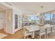 Elegant dining room features a large table and stunning chandelier at 535 Sanctuary Dr # C408, Longboat Key, FL 34228