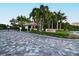 Gated entrance to The Sanctuary, a luxury community with palm trees and meticulously landscaped grounds at 535 Sanctuary Dr # C408, Longboat Key, FL 34228