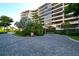 Luxury beachfront condo building with lush landscaping at 535 Sanctuary Dr # C408, Longboat Key, FL 34228