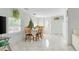 Bright dining area with a marble floor and a wooden table set at 607 2Nd Nw Ave, Ruskin, FL 33570