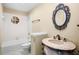 Bathroom with a unique vanity and a decorative mirror at 7217 N Serenoa Dr, Sarasota, FL 34241