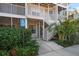 Condo building entrance with stairs and accessible ramp at 850 S Tamiami Trl # 701, Sarasota, FL 34236