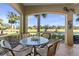 Relaxing screened porch with seating area and picturesque golf course view at 9415 Discovery Ter # 101, Bradenton, FL 34212