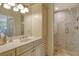 Spa-like bathroom with a walk-in shower and marble tile at 9499 Millbank Dr # 2723, Sarasota, FL 34238