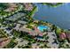 Community clubhouse and recreational amenities near a lake at 1257 Burgos Dr # 302, Sarasota, FL 34238