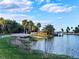 Calm riverfront view with dock, canoes, and lush vegetation at 10459 Myakka Blvd, Myakka City, FL 34251