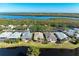 Aerial view of houses near the lake, showcasing waterfront property at 11120 Sanctuary Dr, Bradenton, FL 34209