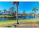 Landscaped backyard with canal views at 11120 Sanctuary Dr, Bradenton, FL 34209
