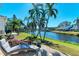 Canal front backyard with patio furniture at 11120 Sanctuary Dr, Bradenton, FL 34209