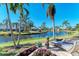 Peaceful backyard oasis with canal views and lounge chairs at 11120 Sanctuary Dr, Bradenton, FL 34209