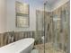 Spa-like bathroom with a free standing tub and a walk-in shower at 11120 Sanctuary Dr, Bradenton, FL 34209
