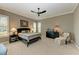 Spacious bedroom with ceiling fan, large windows and plush carpeting at 11120 Sanctuary Dr, Bradenton, FL 34209