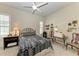 Cozy bedroom with ceiling fan, built-in shelving and window seating at 11120 Sanctuary Dr, Bradenton, FL 34209