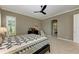 Bright bedroom with ceiling fan, window coverings and ensuite bathroom access at 11120 Sanctuary Dr, Bradenton, FL 34209