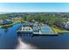 Community pool, tennis courts, and clubhouse with waterfront views at 11120 Sanctuary Dr, Bradenton, FL 34209