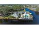 Community pool, tennis courts, and clubhouse with waterfront views at 11120 Sanctuary Dr, Bradenton, FL 34209