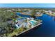 Community pool, tennis courts, and clubhouse with waterfront views at 11120 Sanctuary Dr, Bradenton, FL 34209