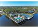 Community pool, tennis courts, and clubhouse with waterfront views at 11120 Sanctuary Dr, Bradenton, FL 34209