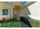 Elegant entryway with a glass door and lush landscaping at 11120 Sanctuary Dr, Bradenton, FL 34209