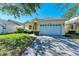 Single-story house with attached garage and manicured lawn at 11120 Sanctuary Dr, Bradenton, FL 34209