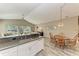 Eat-in kitchen with a wood table and chairs, granite counters and a view to the Gathering room at 11120 Sanctuary Dr, Bradenton, FL 34209